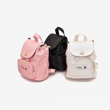 Venta caliente de Corea del pedazo mercancías baratas de la mochila de la escuela de los niños del color del llano de China con los caracteres ingleses para los niños en venta